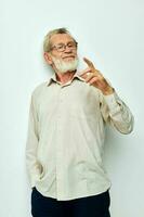 Portrait elderly man wears glasses in shirts isolated background photo