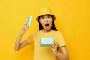 pretty brunette with a gift box in his hands surprise emotions isolated background unaltered photo