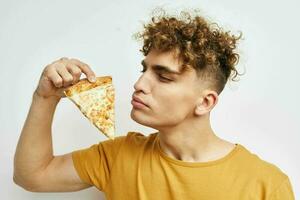 kinky guy eating pizza posing close-up isolated background photo