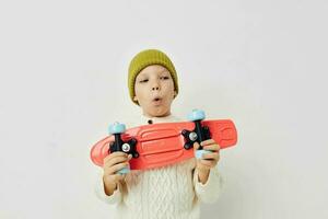 cute girl in hats with a skateboard in their hands Lifestyle unaltered photo