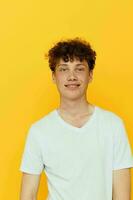 portrait of a young man in a white t-shirt emotions isolated background photo