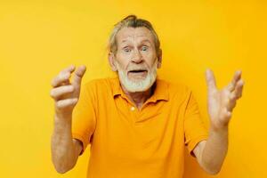 Photo of retired old man with a gray beard emotion gestures hands isolated background
