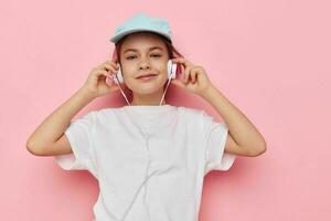 cute girl headphones in a white t-shirt and a cap Lifestyle unaltered photo