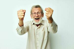 Portrait of happy senior man with a gray beard in a shirt and glasses cropped view photo