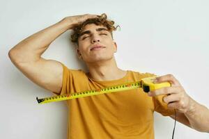 kinky guy grimace measuring tape posing isolated background photo