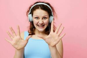 pretty woman with headphones entertainment hand gestures music fun unaltered photo