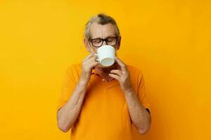 Photo of retired old man in a yellow t-shirt white mug monochrome shot