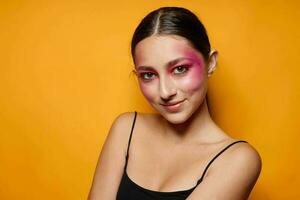 Young beautiful woman bright makeup posing fashion emotions isolated background unaltered photo