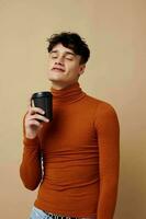 Photo young boyfriend stylish hairstyle brown turtleneck black disposable cup Lifestyle unaltered