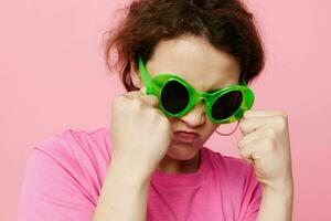 young woman Youth clothing green sunglasses posing modern style Studio Model photo