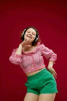 cheerful woman listening to music with headphones dance unaltered photo