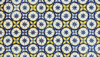 Azulejo tile in Porto, Portugal. Traditional portuguese ceramic decoration blue color. Historic building wall facade. photo