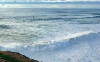 The coastline of Portugal is the best place to relax. Big waves in the Atlantic Ocean for surfing and meditation. photo