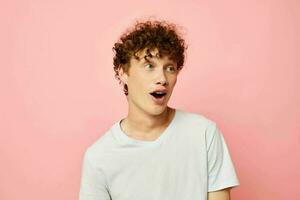 cute red-haired guy posing youth style white t-shirt isolated background unaltered photo