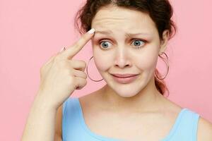 portrait of a young woman grimace close-up emotions earrings posing Lifestyle unaltered photo