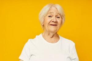 smiling elderly woman in white t-shirt posing fun close-up emotions photo