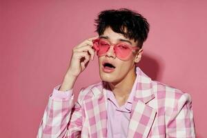 A young man pink shirt and glasses jacket fashion elegant style Lifestyle unaltered photo