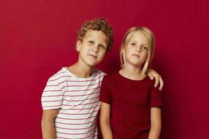 picture of positive boy and girl fun childhood entertainment on colored background photo