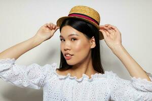 woman in white shirts hat fashion posing light background unaltered photo