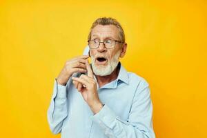 old man talking on the phone posing close-up unaltered photo