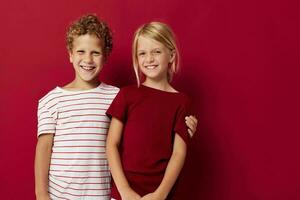 Cute stylish kids fun childhood entertainment red background photo