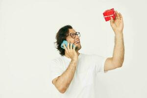 Attractive man Red gift box telephone communication isolated background photo