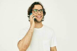 Cheerful man talking on the phone technologies isolated background photo