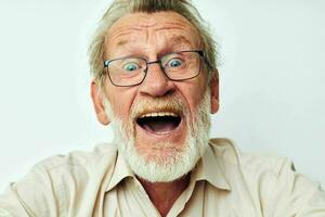 Photo of retired old man with a gray beard in a shirt and glasses unaltered