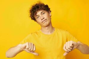 guy with red curly hair wearing stylish yellow t-shirt posing isolated background unaltered photo