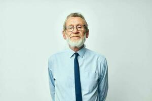 elderly man with gray beard in business office suit photo