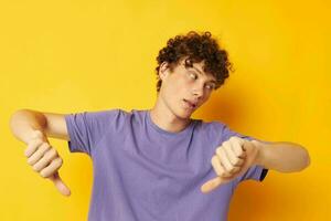 red-haired curly guy in a purple t-shirt gesture hands emotions photo