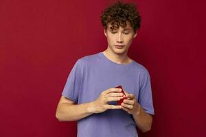 cute guy with curly hair valentine heart-shaped gift photo