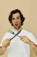 handsome man emotions knife and fork kitchenware isolated background photo