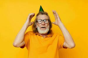 Portrait of happy senior man wearing glasses green cap on his head holiday emotions unaltered photo