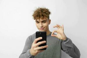 handsome guy talking on the phone posing emotions isolated background photo