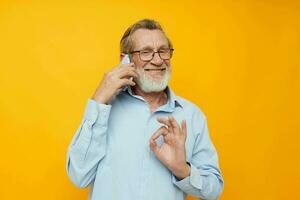 old man talking on the phone posing close-up unaltered photo