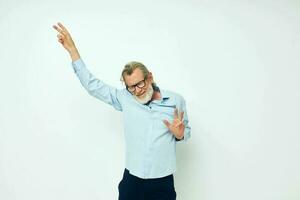 Portrait elderly man in shirt and glasses posing emotions isolated background photo