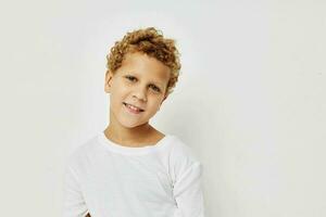 Photo of young boy smile in white t-shirt isolated background