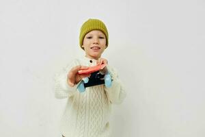 little girl in hats with a skateboard in their hands childhood unaltered photo