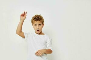 curly boy smile in white t-shirt isolated background photo