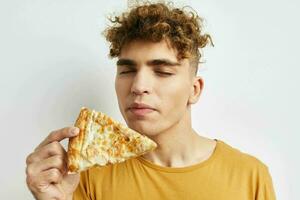 kinky guy eating pizza posing close-up isolated background photo