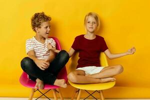 Portrait of cute children smiling and posing in casual clothes against isolated background photo