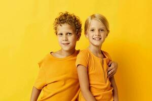 Cute stylish kids casual wear games fun together posing on colored background unaltered photo