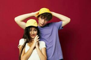 young man and girl stand side by side fashion modern style home fun isolated background photo