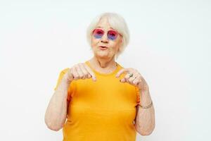 Photo of retired old lady happy lifestyle in yellow t-shirts close-up emotions