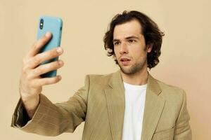 Cheerful man takes a selfie classic style technologies isolated background photo