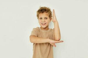 cute little boy on a light background posing smile photo