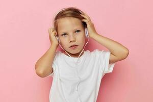 Portrait of happy smiling child girl smile posing headphones isolated background photo