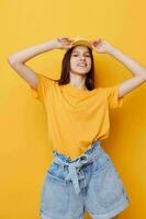 young beautiful woman hand gesture emotions summer style yellow background photo