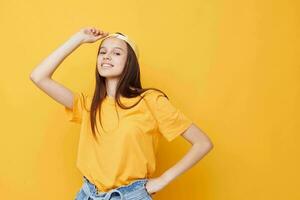 beautiful woman Youth style casual wear yellow background photo